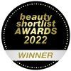 A round black and gold badge with the text beauty shortlist AWARDS 2022 WINNER in the center, highlighting Laponie of Scandinavia's award-winning Balancing Essence Mist for sensitive skin.