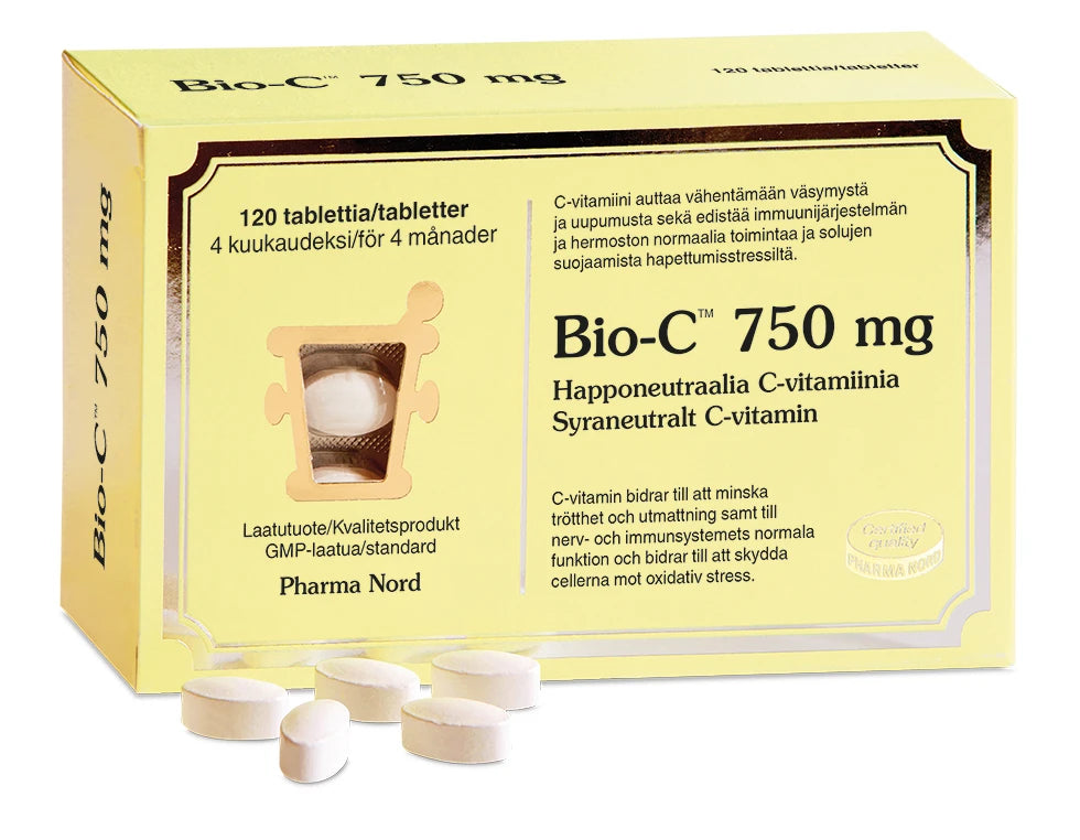 A yellow box of Pharma Nord Bio-C Vitamin 750 mg, with a window showing the tablets and some white oval tablets in front. The box features text in Finnish and Swedish.