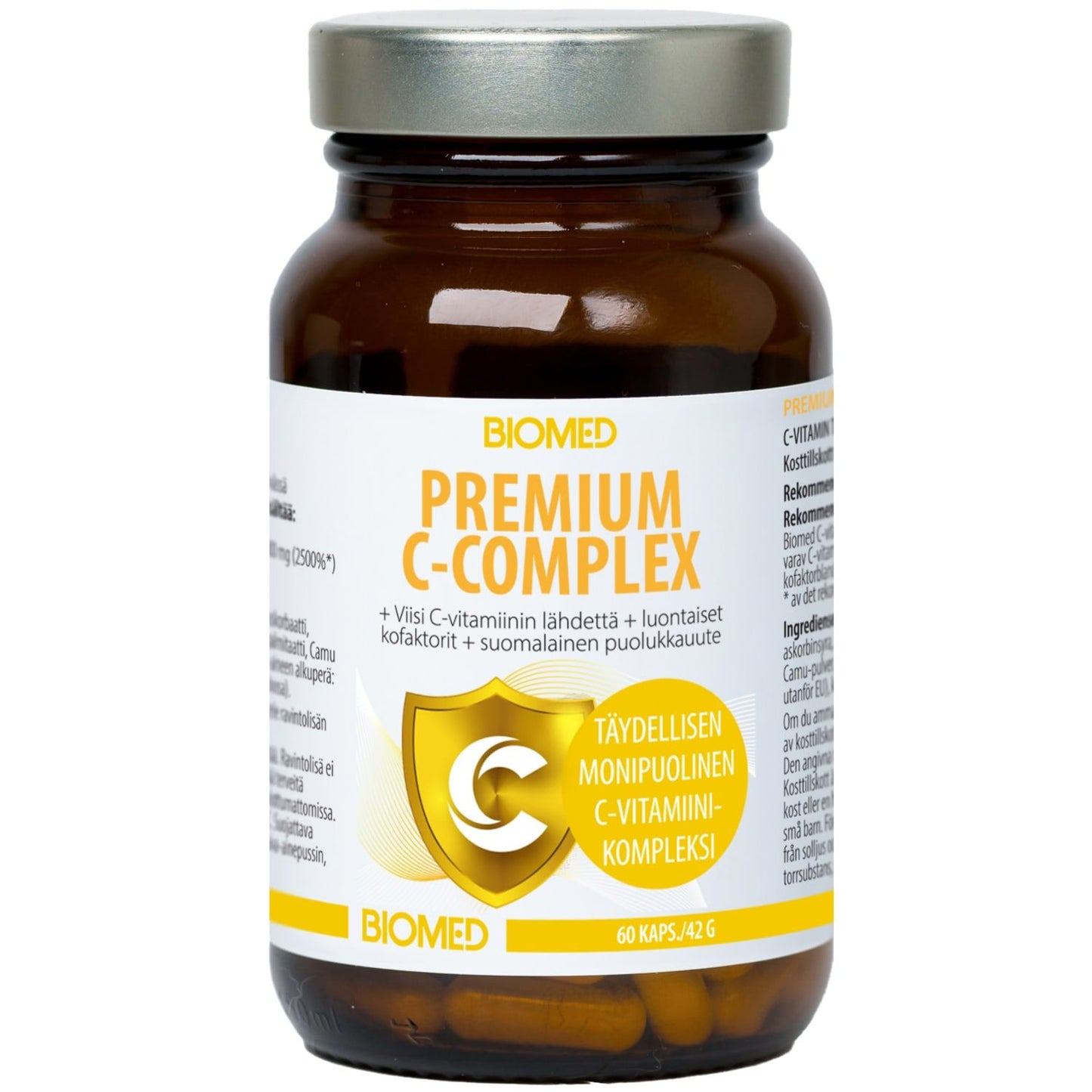 A brown glass bottle labeled Biomed Premium C-Complex by Biomed features a gray lid and a white-yellow Finnish/English label emphasizing immune support. Contains 60 Vitamin C complex capsules with Finnish lingonberry extract.