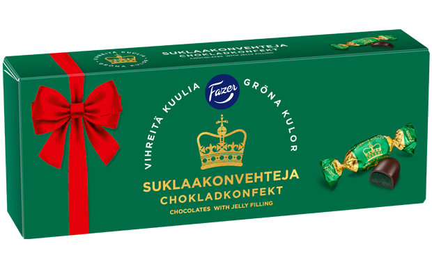 A green and red box of Fazer Green Jellies Praline by Fazer, featuring pear jelly-filled chocolates. The box is adorned with a red ribbon and gold crown graphic, with one unwrapped dark chocolate and one wrapped candy displayed to the right.