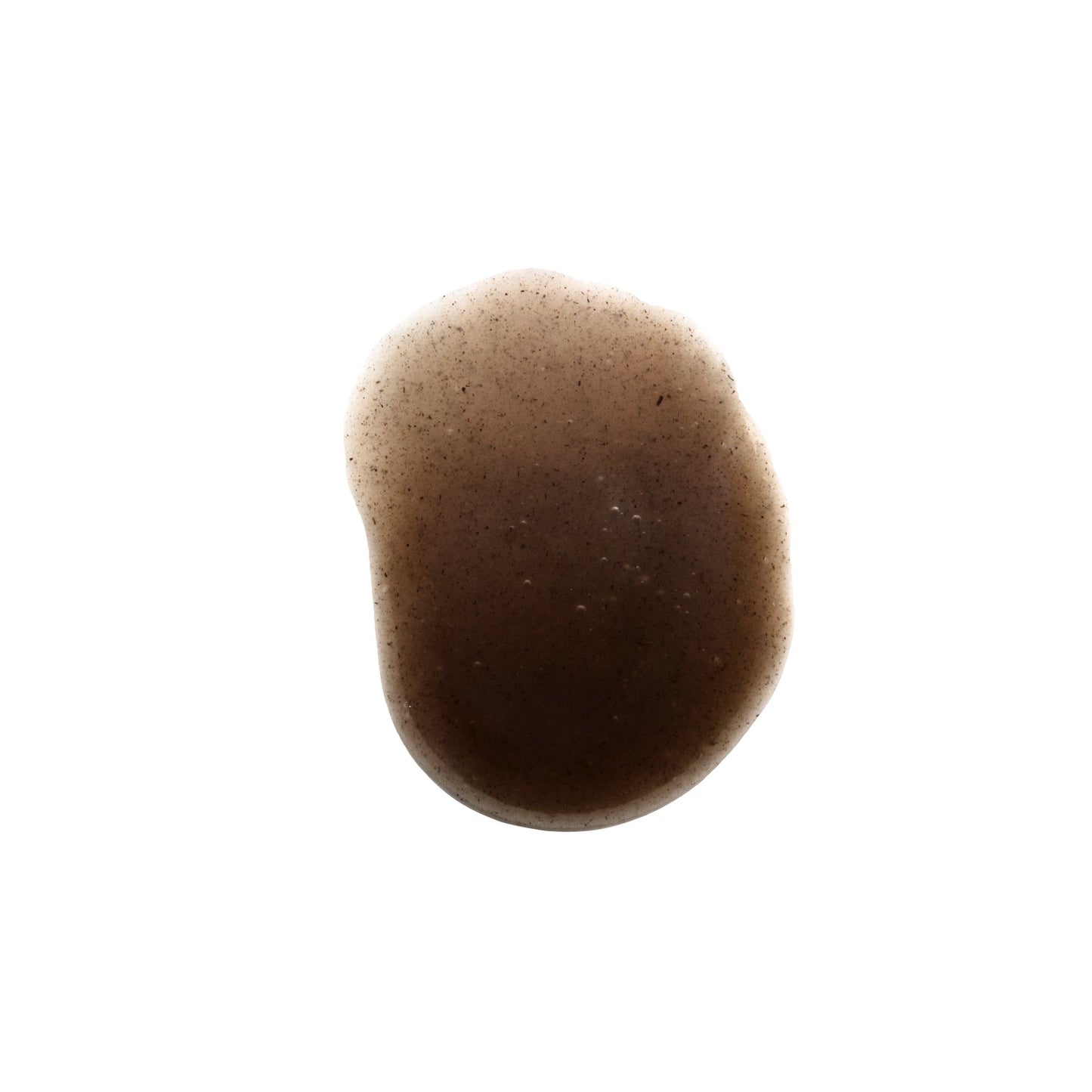 A single, irregularly shaped brown liquid stain—evoking the concentrated essence of NOBE Forest Elixir® Microbiome Enriching Gel Moisturizer by NOBE Nordic Beauty—rests on a white background with darker edges and a subtle color gradient.