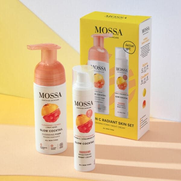 The Mossa Vitamin C Gift Set by Mossa features a cleansing foam and brightening moisturizer in fruit-themed yellow packaging, beautifully arranged on a pastel yellow and peach background.