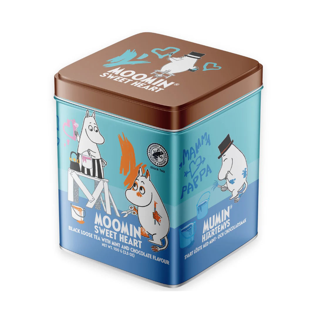 The Nordqvist Moomin Sweet Heart Leaf Tea comes in a square tin featuring playful Moomin characters and charming English and Finnish text, holding black mint chocolate leaf tea.