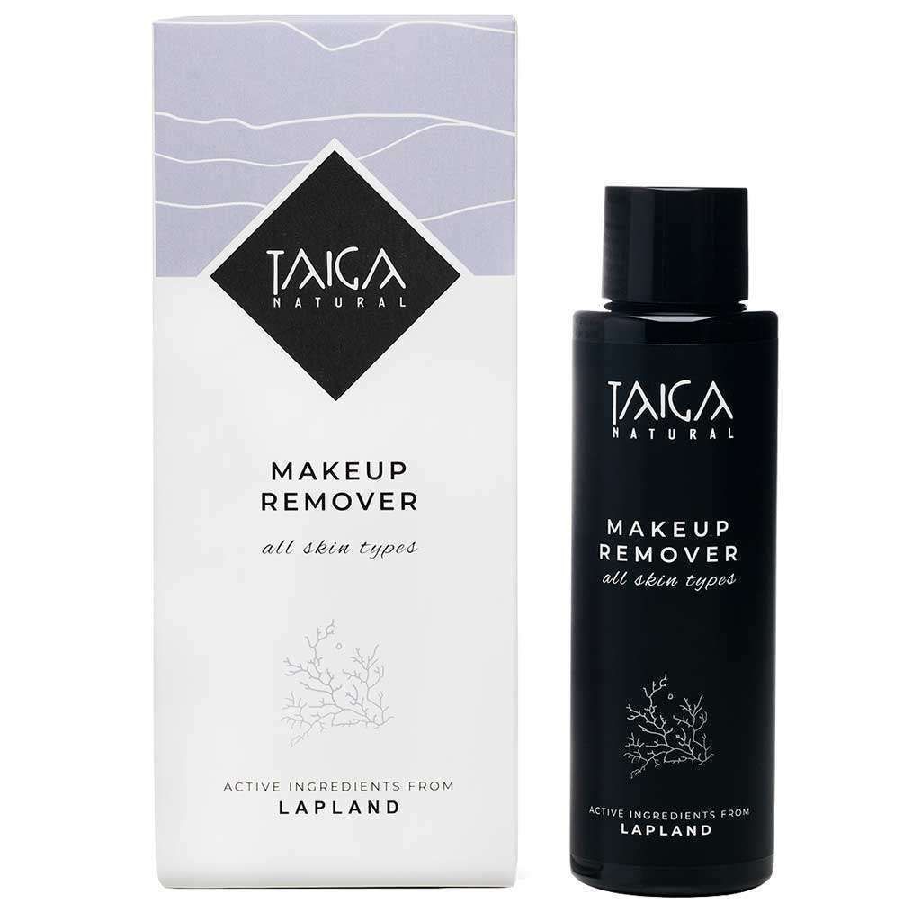 A black bottle of Taiga Cosmetics Makeup Remover All Skin Types sits beside its white and gray box, both featuring the brand name and emphasizing natural ingredients like Lapland lingonberry extract, suitable for all skin types.