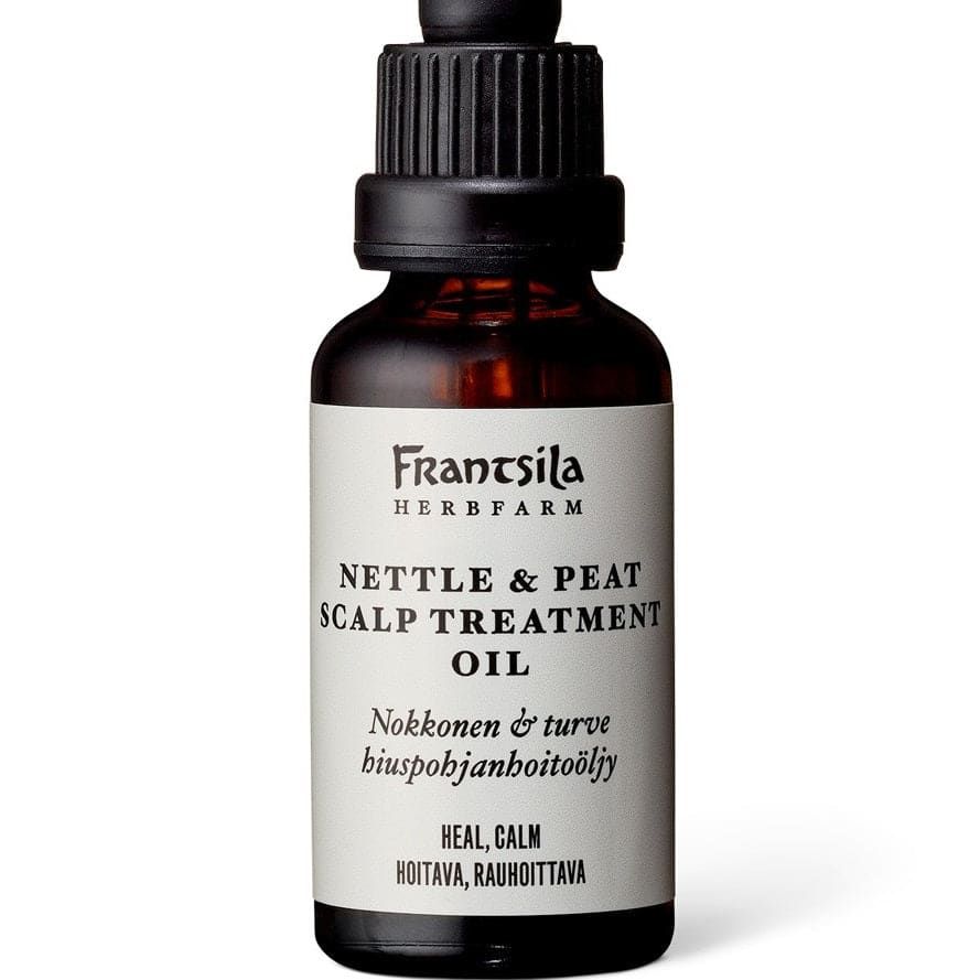 A dark glass dropper bottle labeled Frantsila Nettle & Peat Scalp Treatment Oil, designed to soothe dry, itchy scalp, featuring English and Finnish text, with a black screw cap and dropper. Brand: Frantsila.