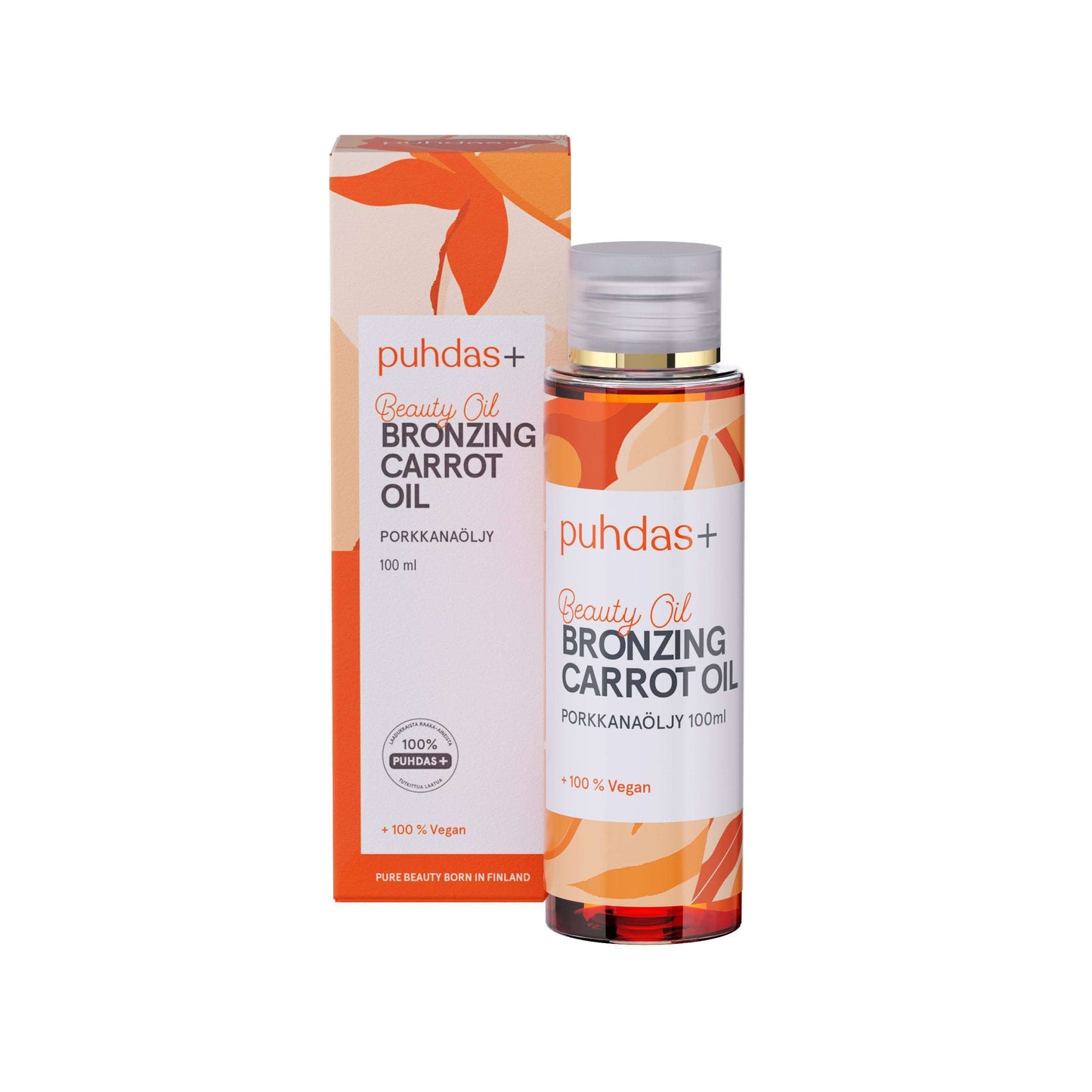 A 100 ml bottle of Puhdas+ Beauty Bronzing Carrot Oil stands beside its matching orange and white box with leaf designs and bilingual English-Finnish product details.