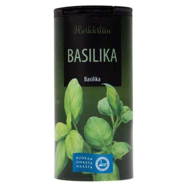 A green cylindrical container of Heikkilä's Basil features basil leaf imagery and Finnish text—ideal as a classic pasta herb from the Heikkilä's brand.
