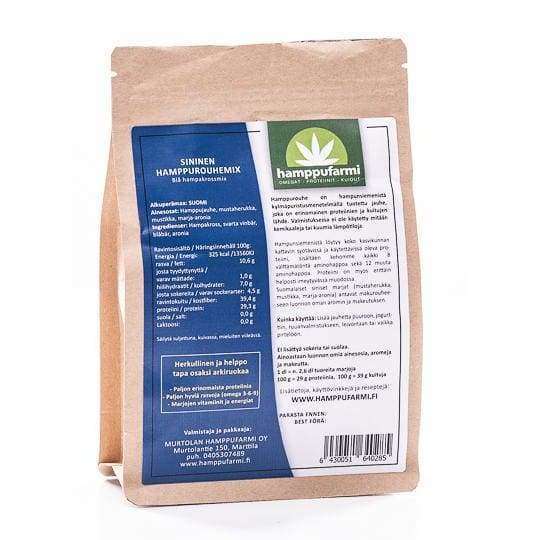 A brown paper package of Nordic Hempfarm Blue Hemp Mix displays detailed product info and nutrition facts in Finnish on the back. Made by Nordic Hempfarm with Finnish berries and hemp groats, this blend contains no added sugar.