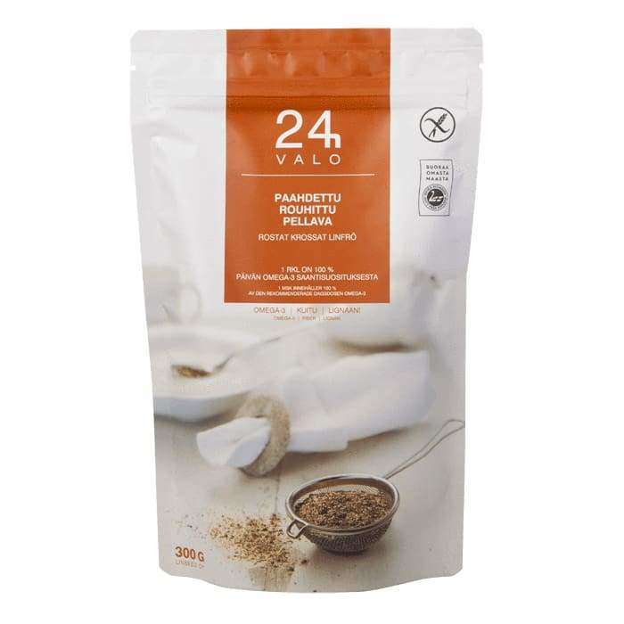 A 300g white and orange resealable bag labeled Valo24h Roasted Ground Flaxseed features omega-3-rich flaxseed, a spoon and strainer image, certification and nutrition icons. Brand: Valo24h.