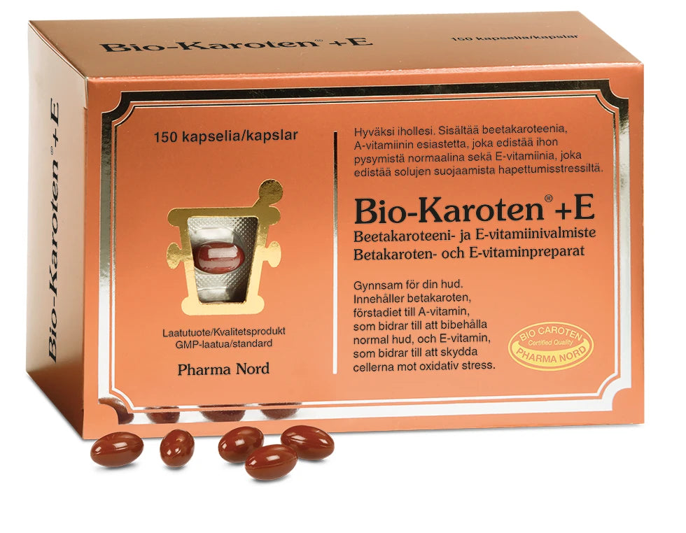 A box of Pharma Nord Bio-Carotene + E capsules, with betacarotene for vision support. The orange pack shows Finnish and Swedish text, product info, and a window revealing brown gel capsules inside.