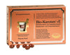 A box of Pharma Nord Bio-Carotene + E with 60 capsules is displayed. Several brown oval capsules, containing betacarotene and vitamin E, are in front of the orange-and-gold box with Finnish and Swedish text.