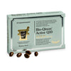 A box of Pharma Nord’s Bio-Qinon Q10 GOLD, containing 30 Coenzyme Q10 capsules beside brown softgels. The metallic green packaging features Finnish and Swedish text with gold accents.