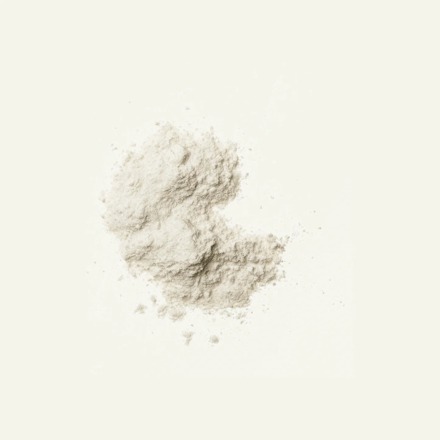 A small heap of DENSE Beef Collagen Natural powder by DENSE, fine and off-white, is scattered on a plain, light background.