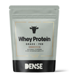 DENSE Grass-Fed Whey Protein Chocolate comes in a silver and black pouch with a cow icon, featuring natural flavors, high bioavailability, and offering an organic, low-carb protein powder option.