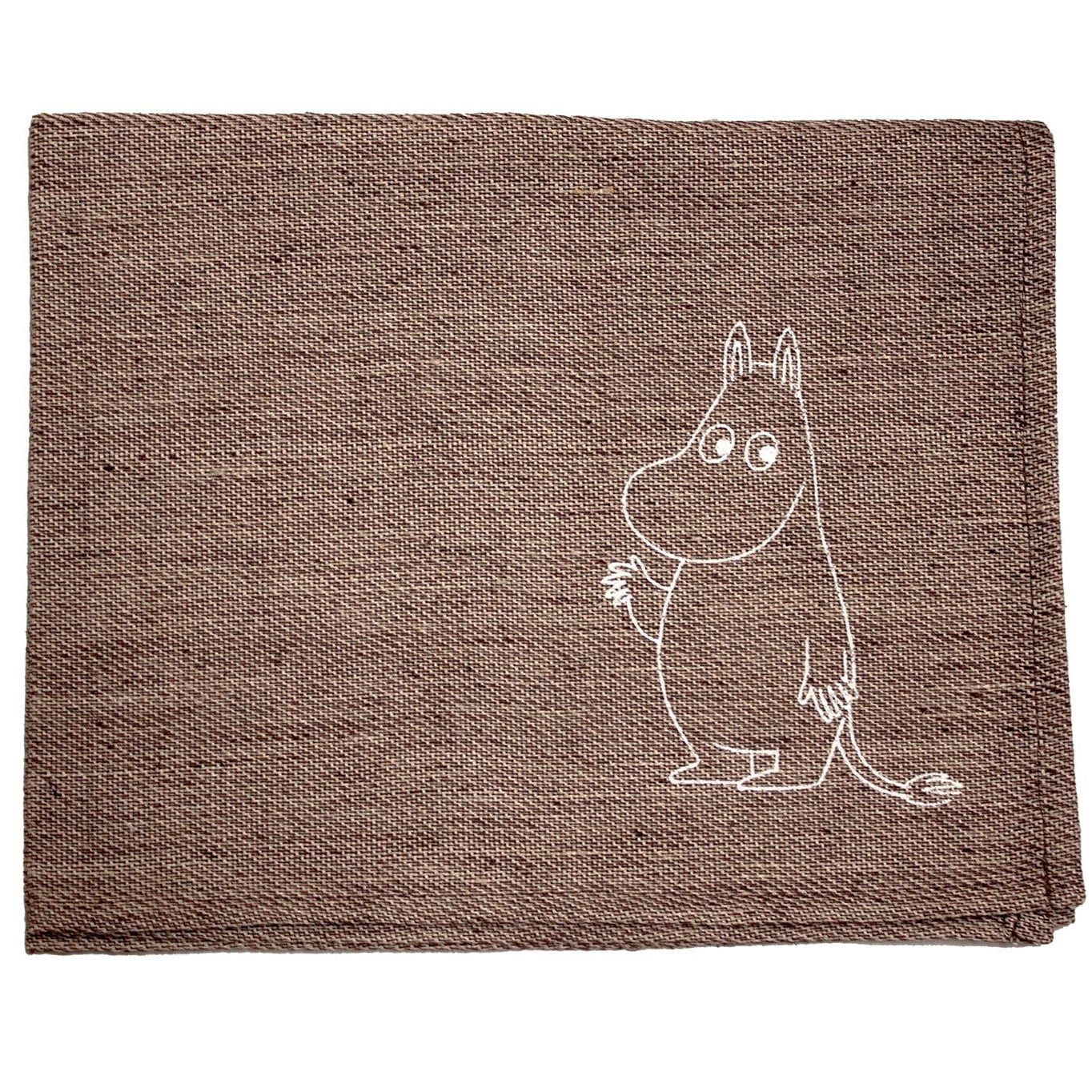 The Emendo Moomin Seat Cover by Emendo is a brown woven linen sauna accessory featuring a white outline of the beloved hippo-like Moomin character near the bottom right corner—a charming Nordic touch for your sauna.