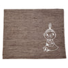 The Emendo Little My Seat Cover is a brown linen sauna accessory featuring a white line drawing of Moomin’s Little My in her signature topknot and dress, perfect as a stylish placemat or sauna seat cover.