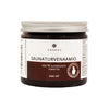 The Emendo Sauna Peat Mask, a 200 ml jar for face and body, features Finnish peat, a white and brown label, a silver lid, and is made by Emendo.
