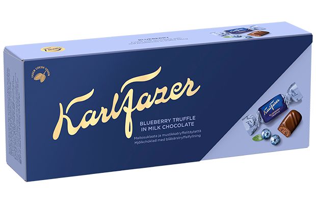 A blue rectangular box of Fazer Blueberry Truffle Praline features gold and white text, the Fazer logo, cocoa bean imagery, and visuals of wrapped Finnish chocolates with a cut-open piece revealing blueberry truffle filling.