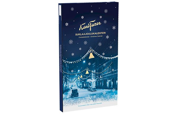 A tall rectangular Christmas advent calendar box by Karl Fazer, shown upright on a plain white background. The box is dark blue with white snowflakes, gold lettering, and a snowy street scene decorated with lights and bells on the front.