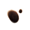 Two irregular brown liquid drops, one large and one small, sit on a white background with slightly fuzzy edges. The glossy semi-transparent look suggests NOBE Forest Drops® Microbiome Booster by NOBE Nordic Beauty.