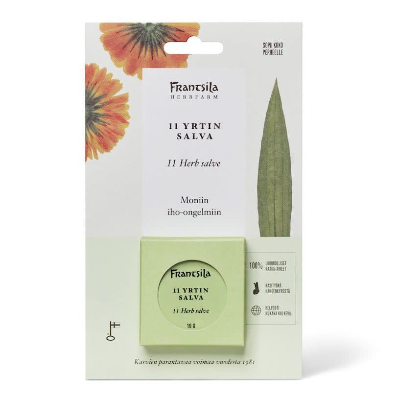 Frantsila 11 Herb Salve by Frantsila comes in a green box with orange and yellow flower designs and Finnish and English text highlighting its natural ingredients and skin care benefits.