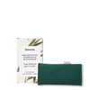 The Frantsila Care Pillow for Eyes and Face, a green therapeutic pillow made from GOTS-certified cotton, is shown in front of its box featuring botanical designs and Finnish-Swedish text, all set against a white background.