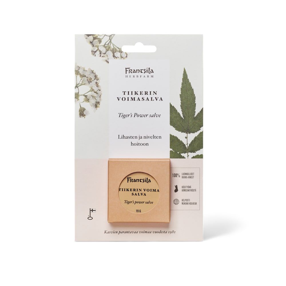 A package of Frantsila Tiger's Power Salve by Frantsila, a natural muscle balm with Finnish and English text, botanical illustrations, and a small container of salve inspired by Traditional Chinese medicine.