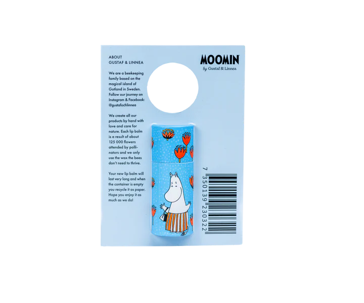 The Gustaf & Linnea Moomin Lipbalm Moominmamma is a blue, eco-friendly lip balm featuring Moominmamma and red tulips on the packaging, with product text, hanging hole, and barcode on the right side.