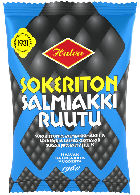 A blue and black pack of Halva Sugar-Free Salty Licorice features yellow and white text, a red logo, and info in Finnish and English. The product’s brand is Halva.