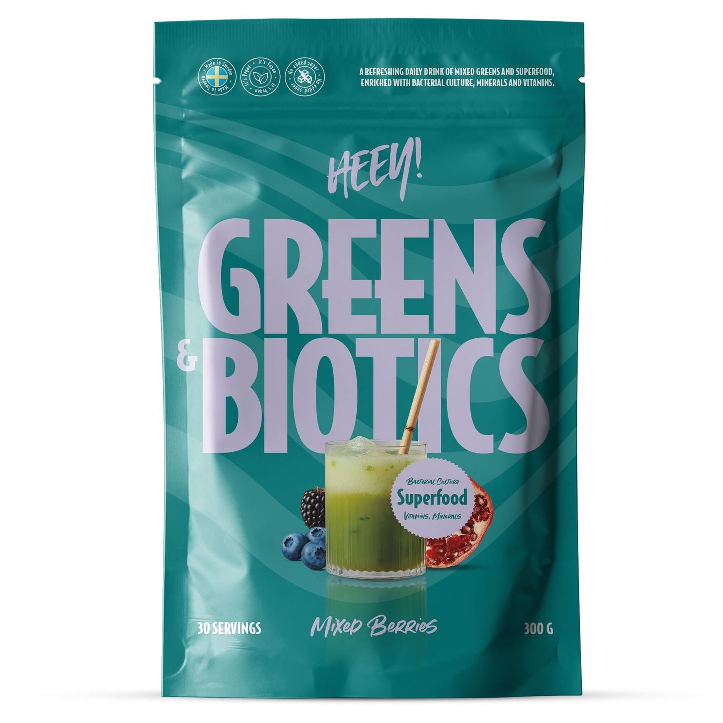 A 300g stand-up pouch of Heey! Greens & Biotics Mixed Berries smoothie powder. The packaging is a vibrant teal color with large white text, featuring an illustration of a green smoothie, berries, and a pomegranate on the front.