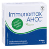 A box of Hankintatukku Immunomax AHCC contains 80 vegan capsules (38g) with shiitake mushroom extract and polysaccharides for immune support. The mainly white and blue packaging features Finnish text with green accents.