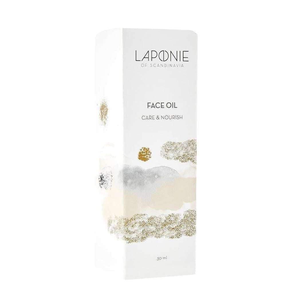 A white rectangular box of Laponie of Scandinavia Face Oil with a minimalist design and subtle beige-gold patterns, perfect for sensitive skin. The front displays: “Face Oil Care & Nourish, 30 ml.” Brand: Laponie of Scandinavia.