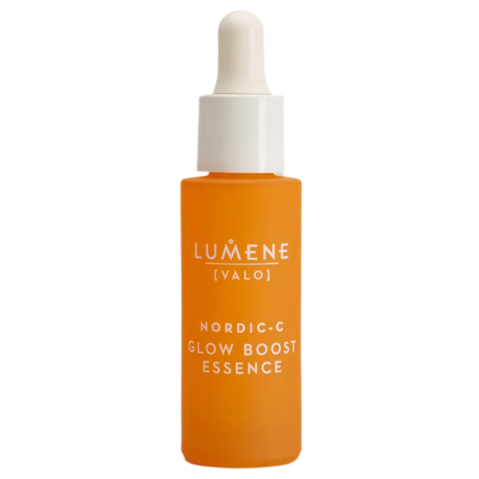 An orange bottle of Lumene Nordic-C Glow Boost Essence vitamin C serum by Lumene, featuring a white dropper cap and white text, formulated with Arctic cloudberry and hyaluronic acid. It is displayed against a plain white background.