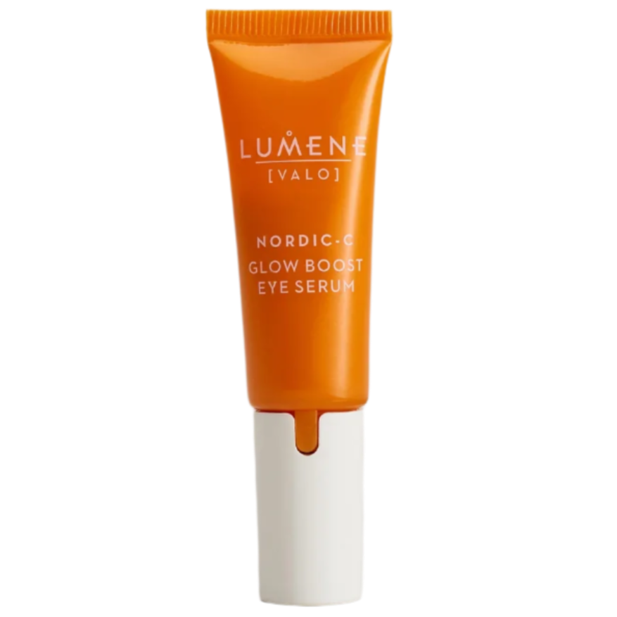 An upright orange tube of Lumene Nordic-C Glow Boost Eye Serum with a white dispenser, formulated to target dark circles, is shown against a plain background.