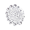 A cluster of glossy, clear droplets forms a circular pattern on white, evoking the hydration and freshness of Lumene Nordic-C Glow Refresh Hydrating Mist by Lumene in a delicate, abstract style.