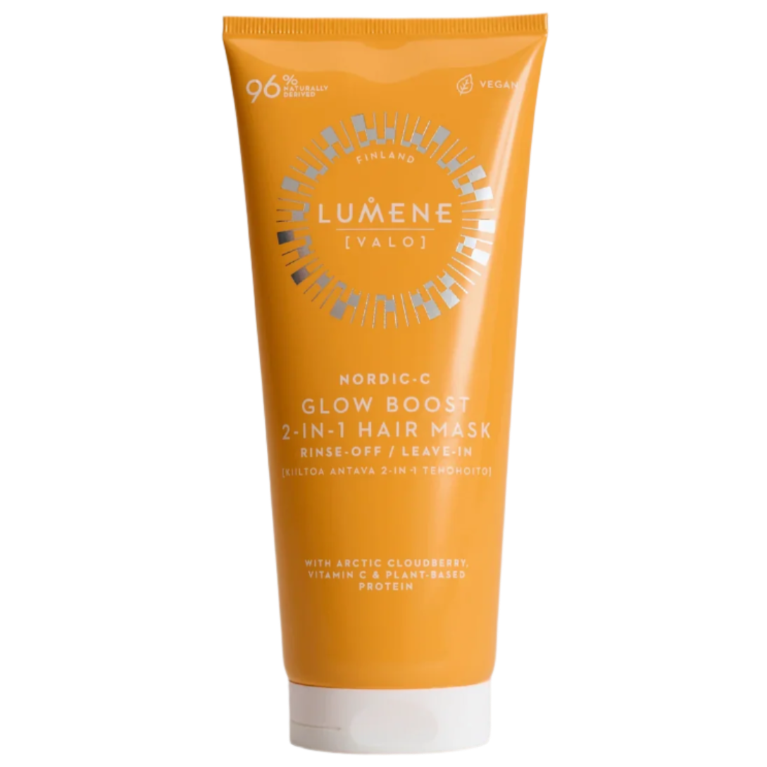 An orange tube of Lumene Nordic-C Strength & Shine 2-in-1 Hair Mask, labeled rinse-off or leave-in, features Arctic cloudberry, vitamin C, plant-based protein and vegan packaging with 96% natural origin.