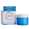 A blue and white jar of Lumene Nordic Hydra Moisture Balm with triple hyaluronic acid sits next to its box, which emphasizes deep hydration for normal to dry skin and reduced packaging material.