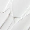 A close-up of Lumene Nordic Hydra Moisture Balm by Lumene, featuring smooth, white cream with triple hyaluronic acid, spread in soft waves to showcase its deep hydration benefits.