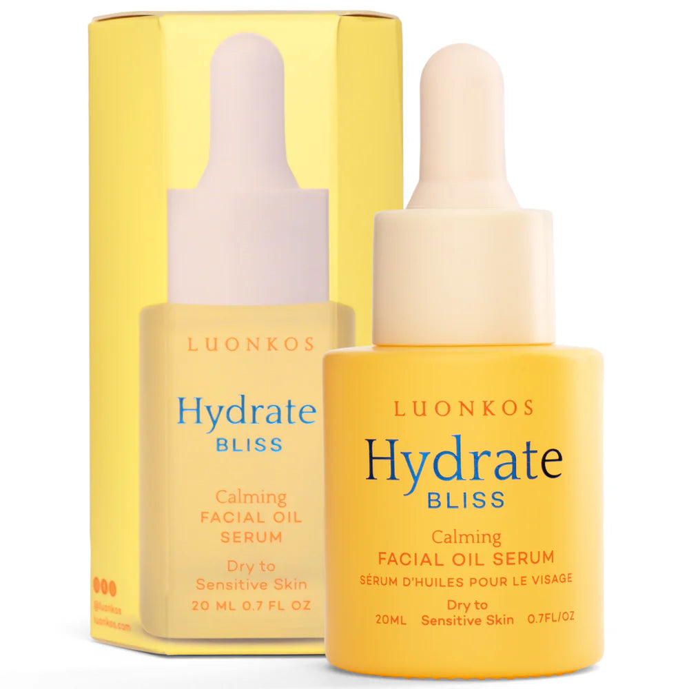 A yellow bottle of Luonkos Bliss Facial Oil Serum with a dropper, suitable for dry to sensitive skin. This fragrance-free serum by Luonkos stands in front of its matching yellow box packaging.