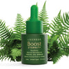 A green dropper bottle labeled Luonkos Eternity Facial Oil Serum rests among lush ferns. The text highlights its natural microbiome, Finnish forest microbe extract, and suitability for all skin types. Brand: Luonkos.