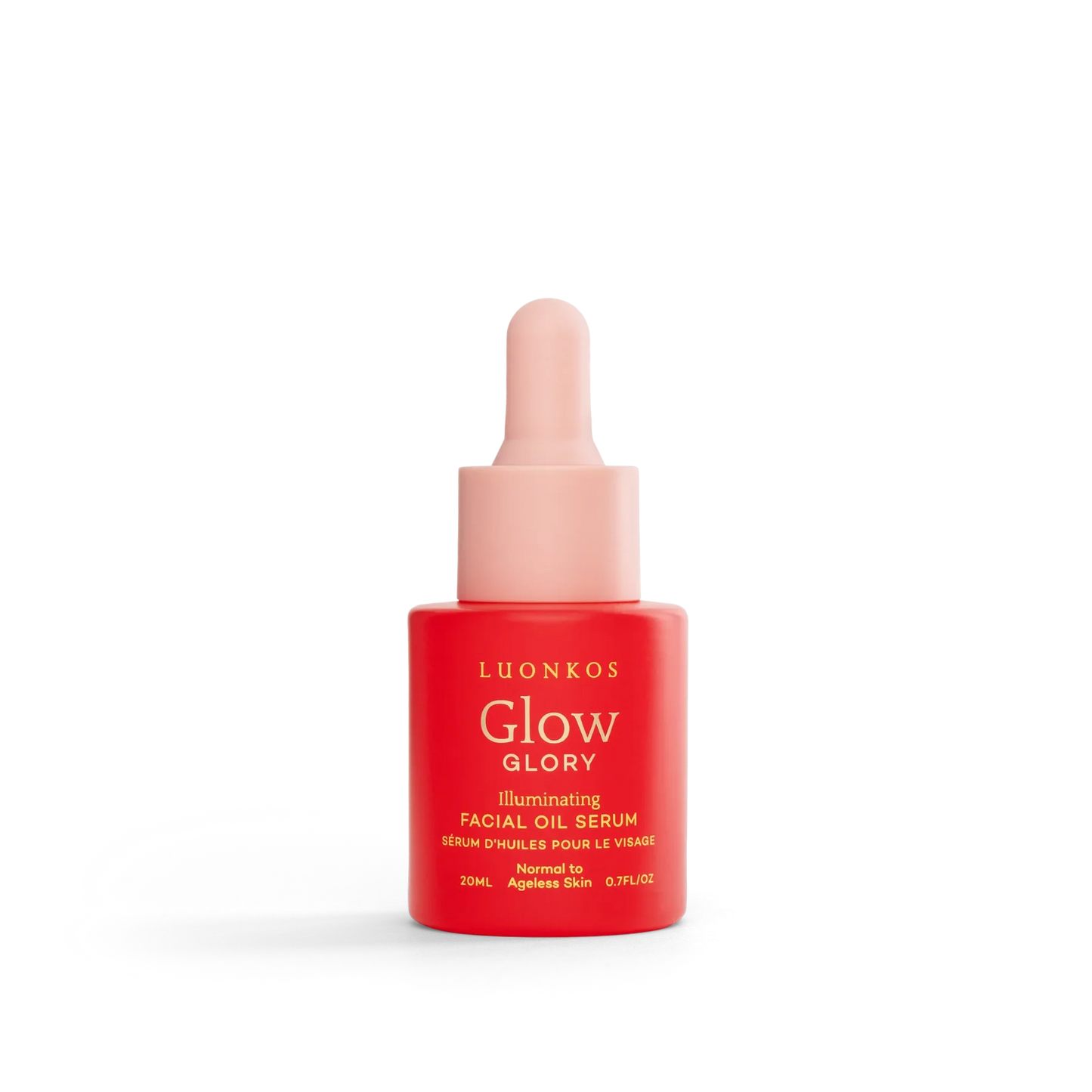 A red and pink dropper bottle from the Luonkos Glow & Shine Skincare Set stands upright on a white background—a radiant Finnish natural cosmetic for your daily routine.