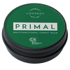 A green, round Luonkos tin labeled "Primal Multifunctional Forest Balm" for eczema-prone skin features white text and a tree icon, set against a white background.
