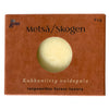 A brown box with a circular window reveals the Metsä/Skogen Wild Flower Field Cream Bar, a round pale yellow cream bar. The box notes it’s responsible forest-luxury, handcrafted in Finland, and is labeled 60g.