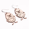 Coruu Moomin Wooden Earrings by Coruu feature playful, furry monster designs with mischievous smiles and whimsical poses—perfect for adding Nordic charm to your jewelry collection.