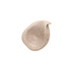 A swirl of NOBE Nordic Beauty's NOBE Forest Elixir® Microbiome Strengthening Body Lotion, beige with visible brown specks, arranged in an irregular circle on a white background.