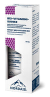 A white and purple rectangular box of Nordaid Vitamin B12 Spray, 30 ml, featuring Finnish and Swedish text, a small mountain graphic, and supporting normal energy metabolism. Brand: Nordaid.