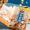 A hand holds the Nordqvist Moomin Advent Tea Calendar, a charming way to count down special days with Nordqvist’s winter or vegan tea blends.