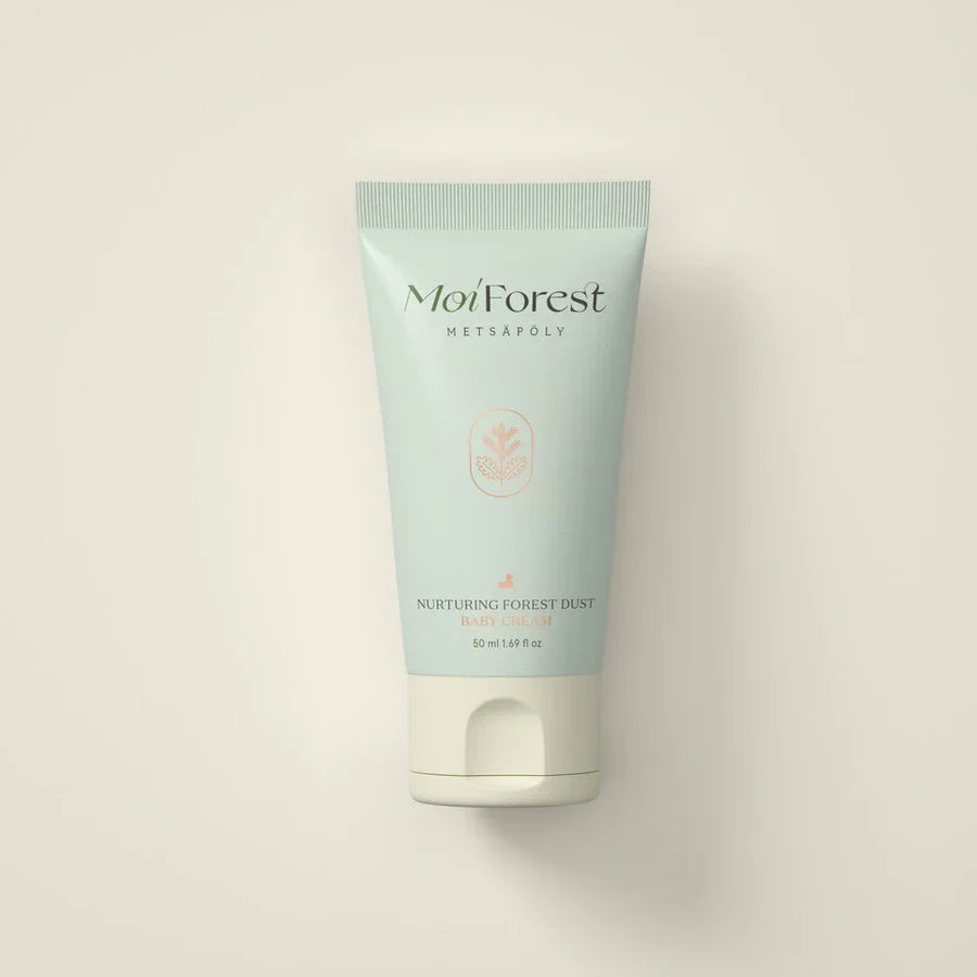 A tube of MoiForest Nurturing Forest Dust moisturizer, featuring a pale mint green body and a white flip-top cap, centered against a warm off-white background.