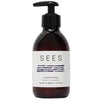 A brown pump bottle of SEES Company’s Hand & Body Lotion, featuring blue line art on a white label, combines lavender and orange scents. Made in Finland, it's part of their vegan skincare collection.