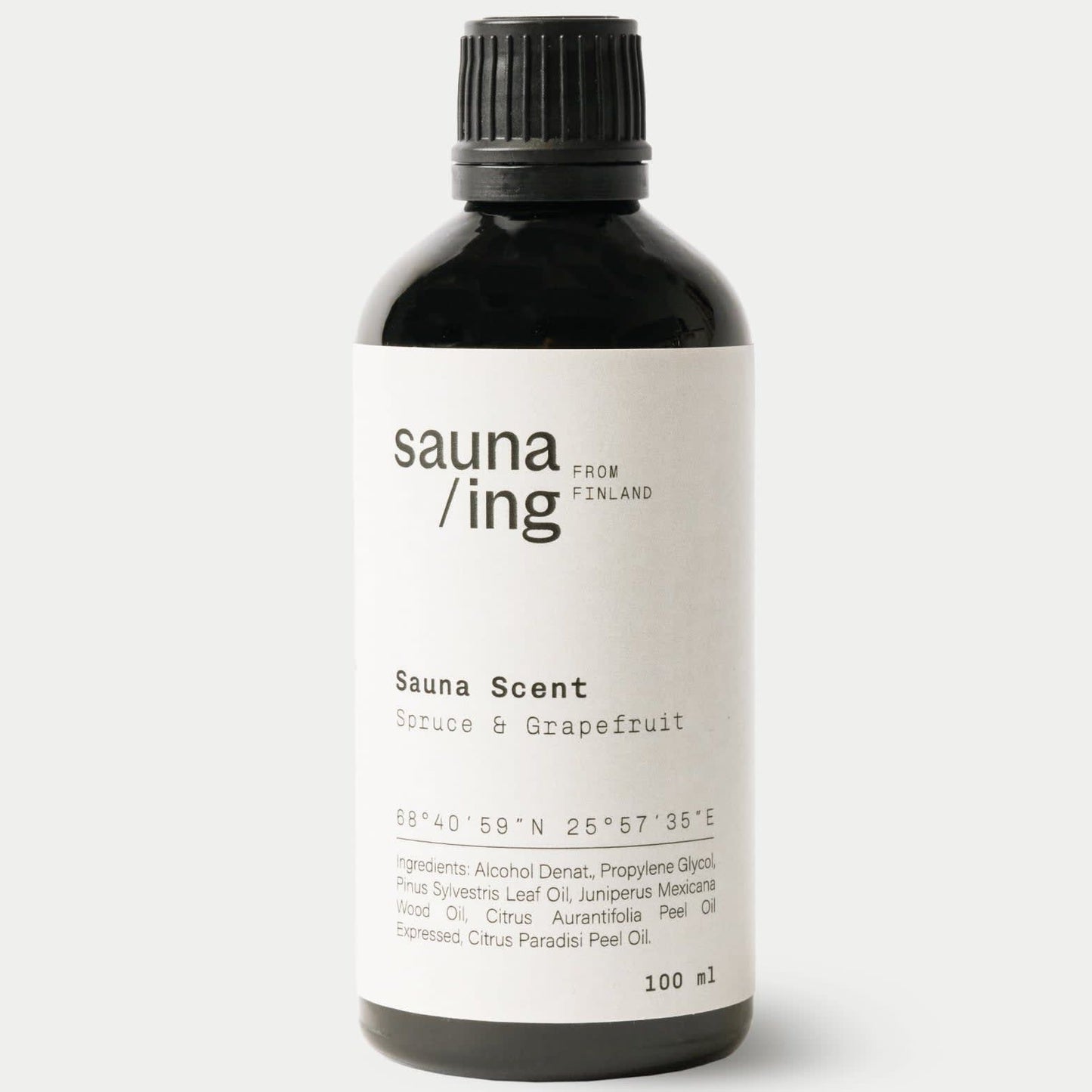 A black 100ml bottle of sauna/ing Sauna Scent Spruce & Grape from Finland features Nordic fragrance, coordinates and ingredients on the label, plus a black screw cap.